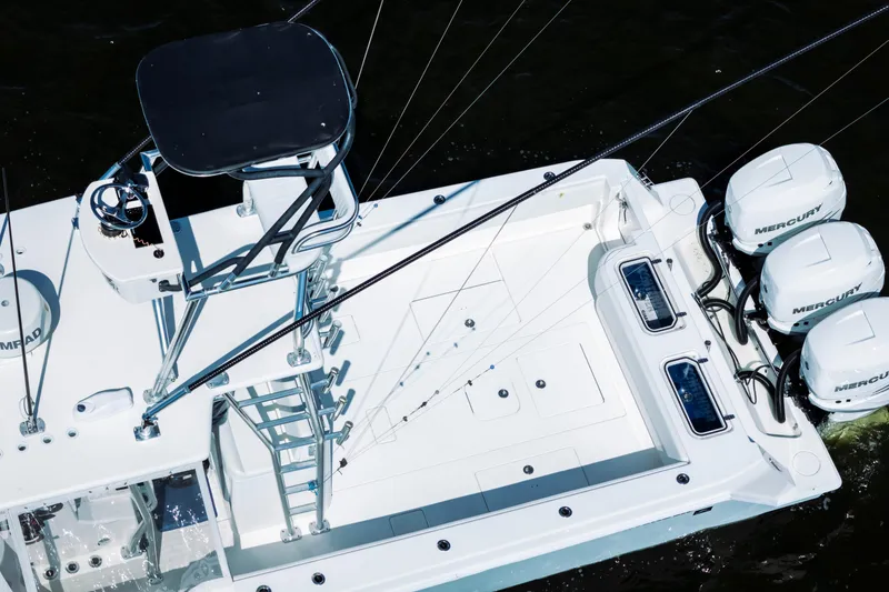 Slide: The Image of 2015 Contender 39 ST boat with triple Mercury engines, aerial view. - 11