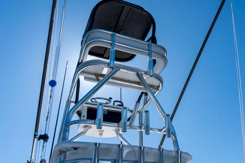 Slide: The Image of Contender 39 ST 2015 boat tower against clear blue sky, showcasing sleek design. - 13