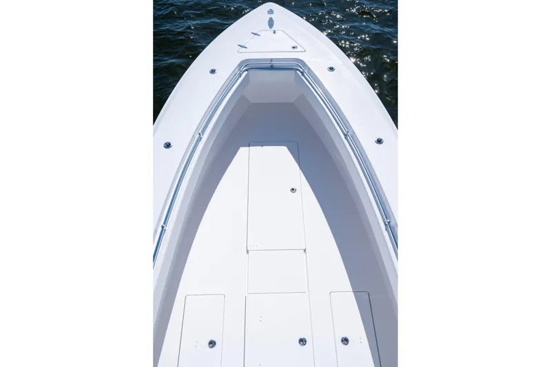 Slide: The Image of 2015 Contender 39 ST boat deck with sleek white finish on water. - 16
