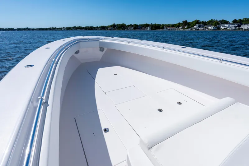 Slide: The Image of 2015 Contender 39 ST boat deck on calm water, clear sky background. - 18
