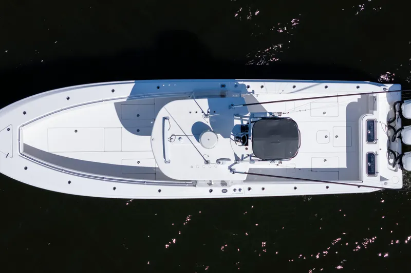 Slide: The Image of Overhead view of 2015 Contender 39 ST boat on dark water. - 2