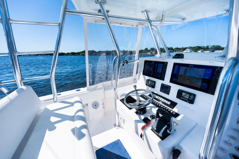 Slide: The Image of 2015 Contender 39 ST boat cockpit with advanced navigation systems and ocean view. - 24