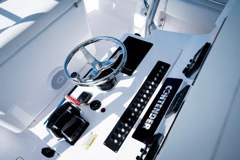 Slide: The Image of Helm of 2015 Contender 39 ST boat with steering wheel and control panel. - 27