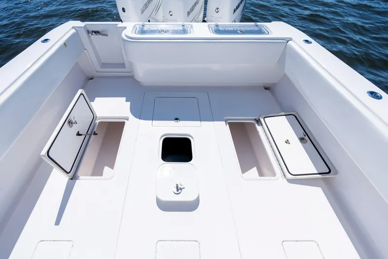 Slide: The Image of 2015 Contender 39 ST boat deck with storage compartments and ocean backdrop. - 30