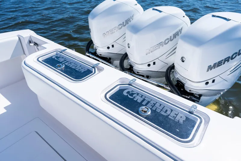 Slide: The Image of 2015 Contender 39 ST boat with triple Mercury engines on water. - 35