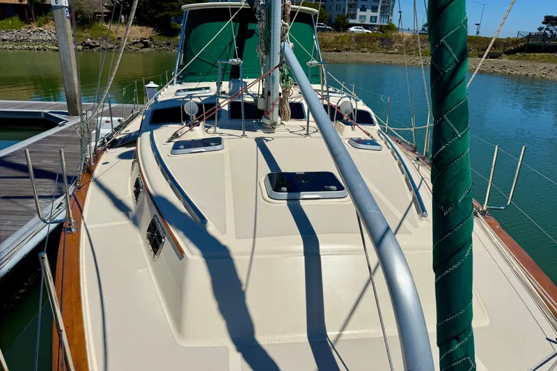 Slide: The Image of 2003 Island Packet 485 sailboat docked, showcasing deck and rigging details. - 14