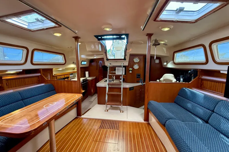 Slide: The Image of Luxurious interior of a 2006 Island Packet 485 yacht with elegant wood finishes. - 19