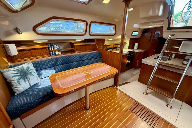 Slide: The Image of Interior of 2006 Island Packet 485 yacht with wooden finishes and cozy seating area. - 21
