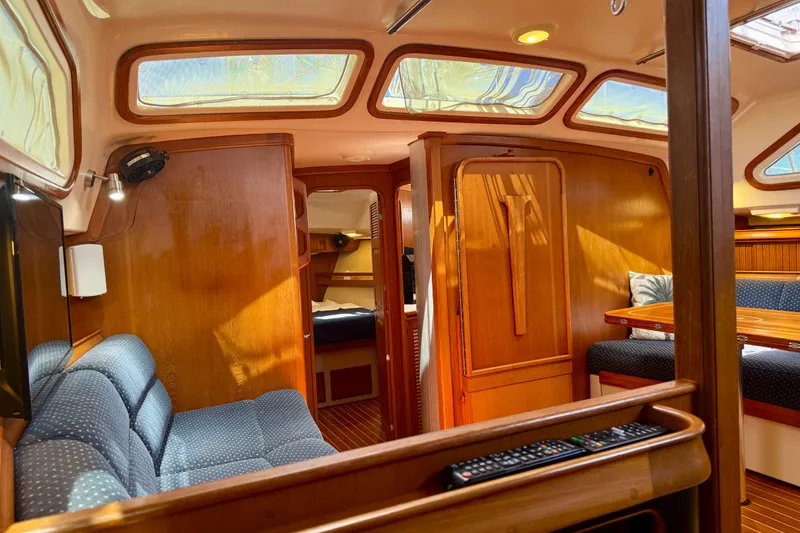 Slide: The Image of Interior of 2006 Island Packet 485 yacht with wood finish and skylights. - 29