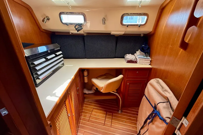 Slide: The Image of Interior of 2006 Island Packet 485 yacht with wooden cabinetry and workspace. - 43