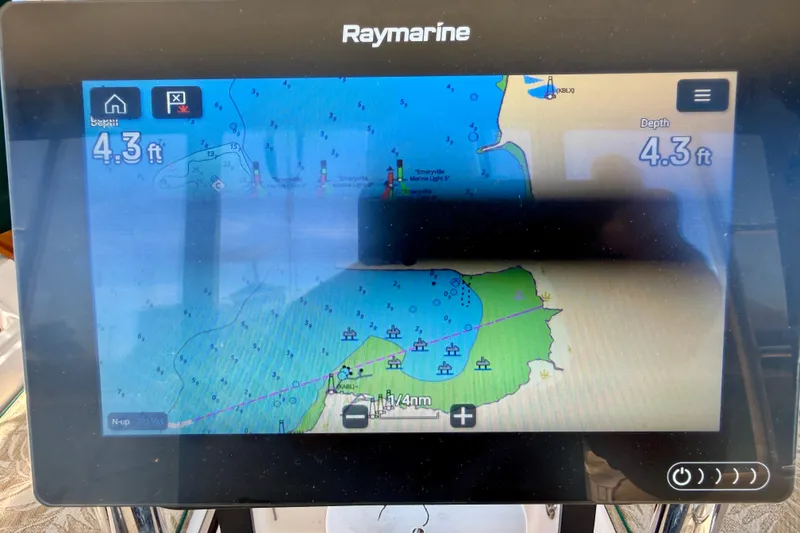 Slide: The Image of Raymarine navigation display showing a nautical chart with 4.3 ft depth on Island Packet 485, 2006. - 48