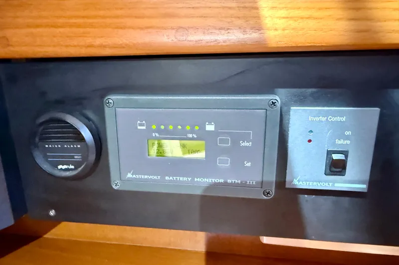 Slide: The Image of Mastervolt battery monitor and inverter control panel on 2006 Island Packet 485 yacht. - 56