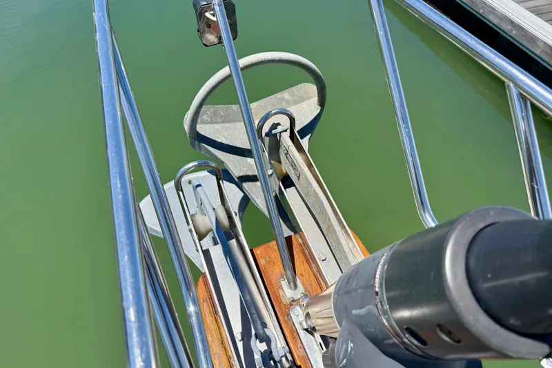 Slide: The Image of Bow of 2003 Island Packet 485 sailboat with anchor and railing details. - 62
