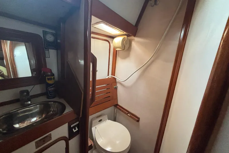 Slide: The Image of Bathroom interior of 1988 Tayana 52 yacht with sink and toilet. - 63