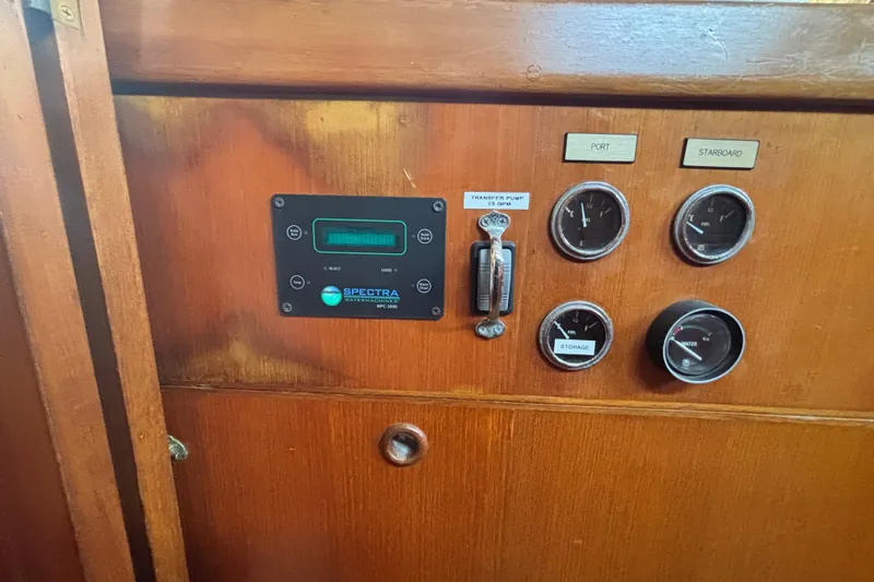 Slide: The Image of Control panel on 1988 Tayana 52 yacht with gauges and Spectra watermaker display. - 49