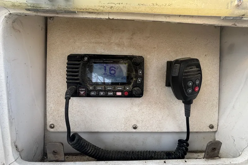 Slide: The Image of VHF marine radio on 1988 Tayana 52 sailboat, displaying channel 16. - 31