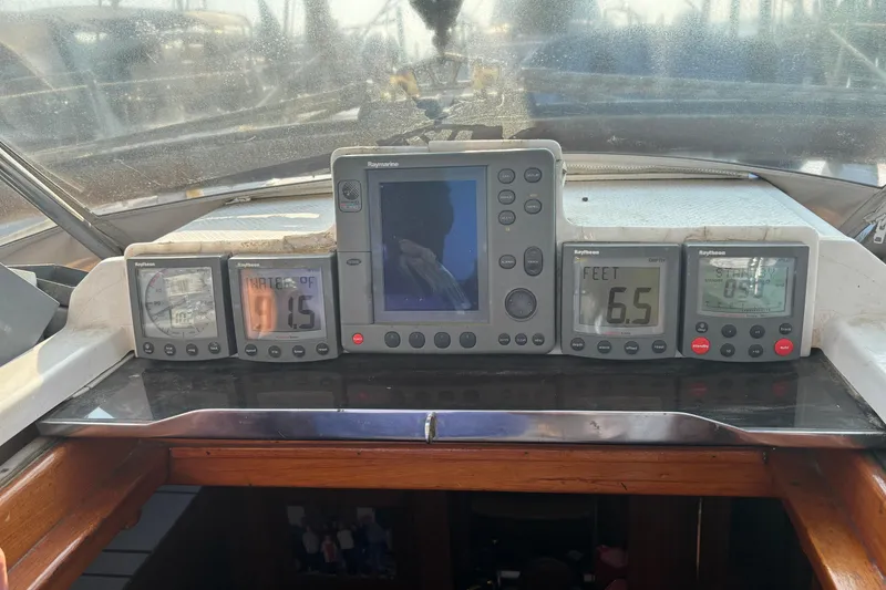 Slide: The Image of Cockpit instruments on a 1988 Tayana 52 sailboat, featuring Raymarine displays. - 27