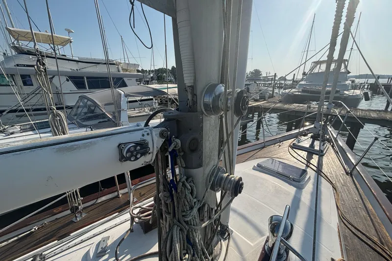 Slide: The Image of 1988 Tayana 52 sailboat deck with rigging and marina view. - 37