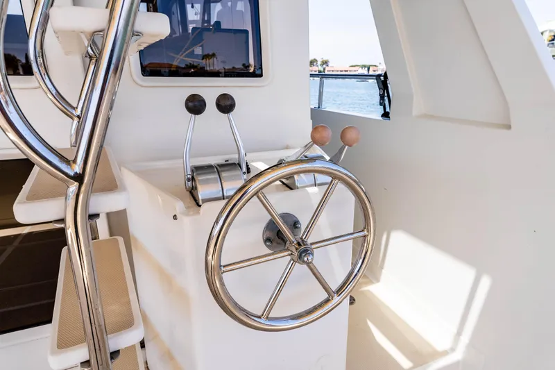 Slide: The Image of Steering wheel and controls of a 2005 Offshore Yachts 54 Pilothouse. - 20