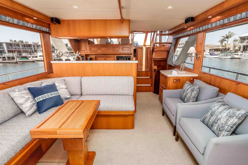 Slide: The Image of Luxurious interior of a 2005 Offshore Yachts 54 Pilothouse with elegant seating and wood finishes. - 21
