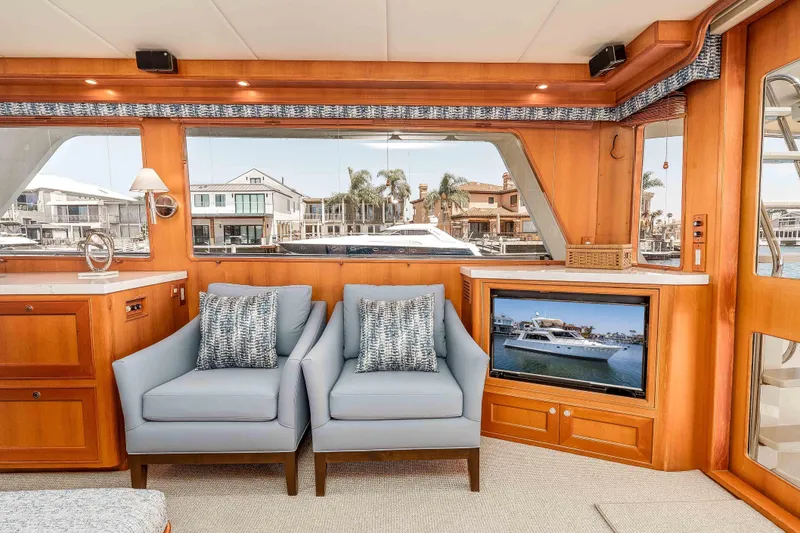 Slide: The Image of Luxurious interior of 2005 Offshore Yachts 54 Pilothouse with elegant seating and waterfront view. - 24