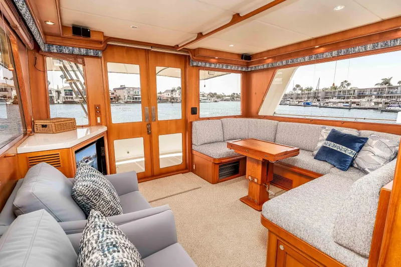 Slide: The Image of Luxurious interior of 2005 Offshore Yachts 54 Pilothouse with plush seating and waterfront view. - 25