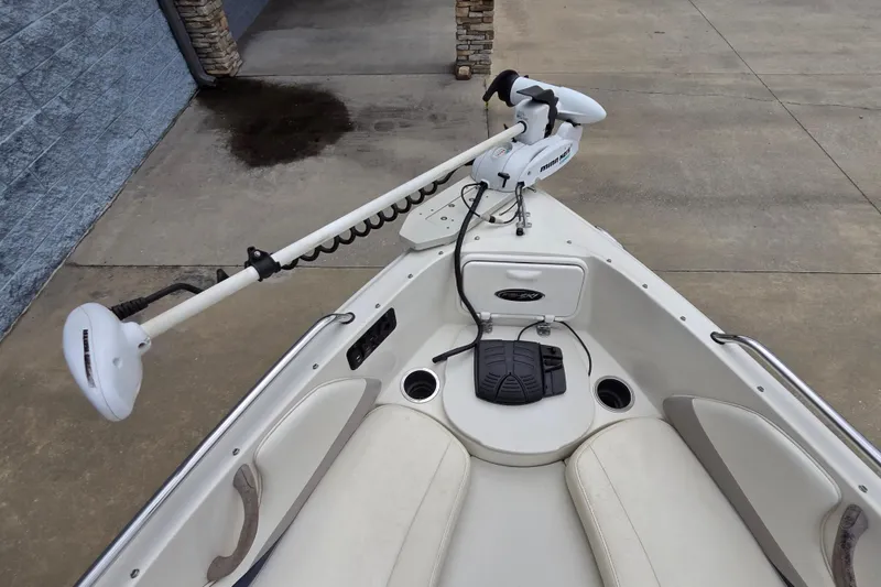 Slide: The Image of 2013 Stingray 191 LX boat bow with trolling motor and seating area. - 12