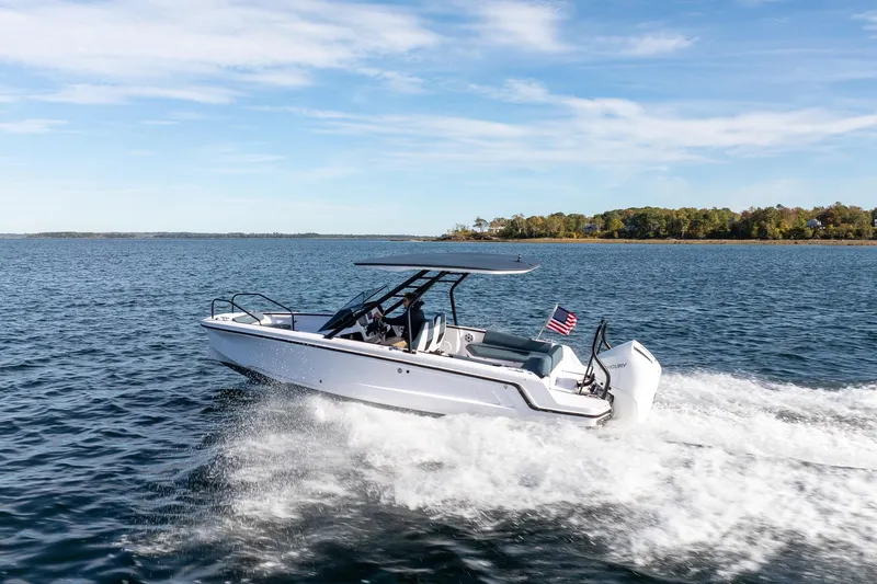 Slide: The Image of Axopar 22 T-Top boat 2026 cruising on water. - 10
