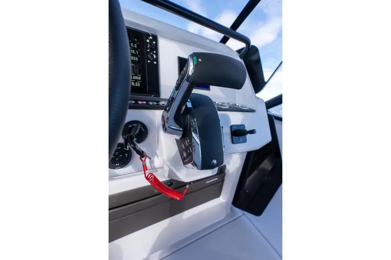 Slide: The Image of Axopar 22 T-Top 2026 helm with throttle control. - 15