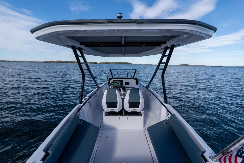 Slide: The Image of Axopar 22 T-Top boat on open water, model year 2026. - 22