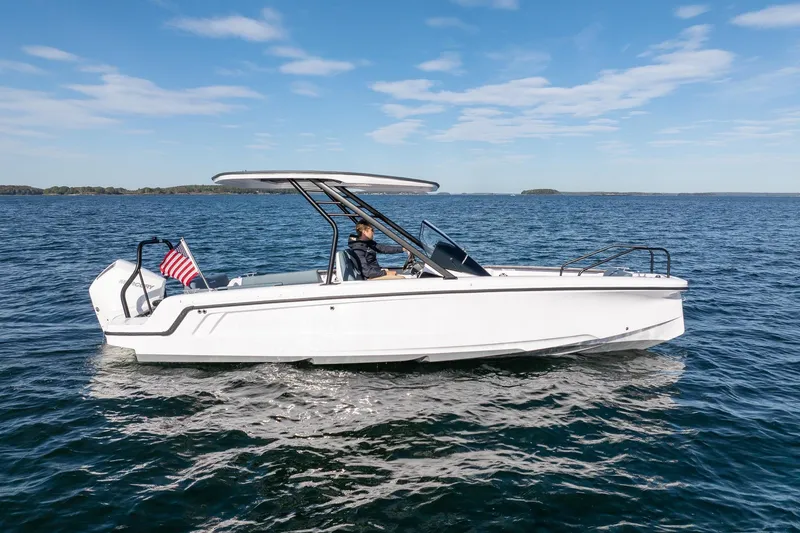 Slide: The Image of Axopar 22 T-Top boat 2026 on open water. - 9