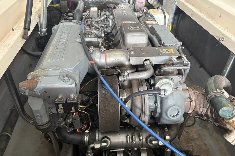 Slide: The Image of Engine compartment of a 2003 Mainship Pilot 30-II, featuring a Yanmar marine engine. - 17