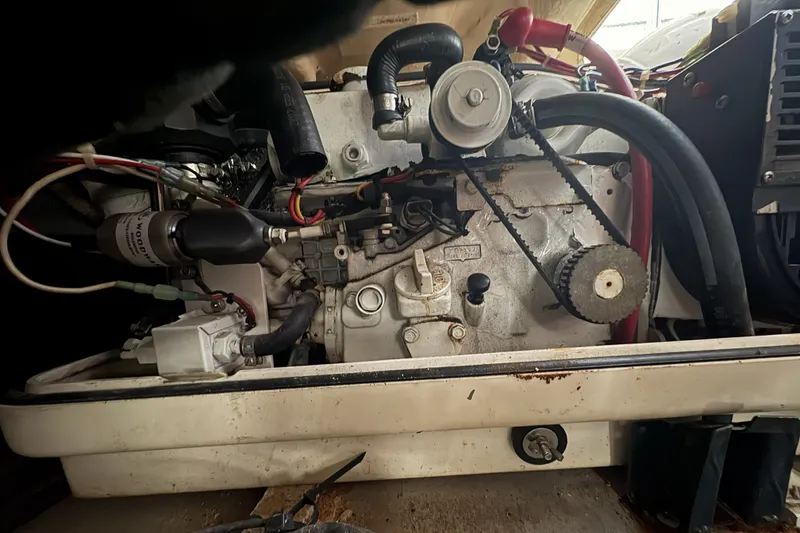 Slide: The Image of Engine compartment of a 2003 Mainship Pilot 30-II boat, showcasing mechanical components. - 20