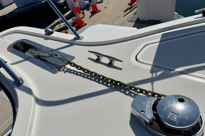 Slide: The Image of 1998 Tiara Yachts 3500 Express deck with anchor chain and cleat. - 10