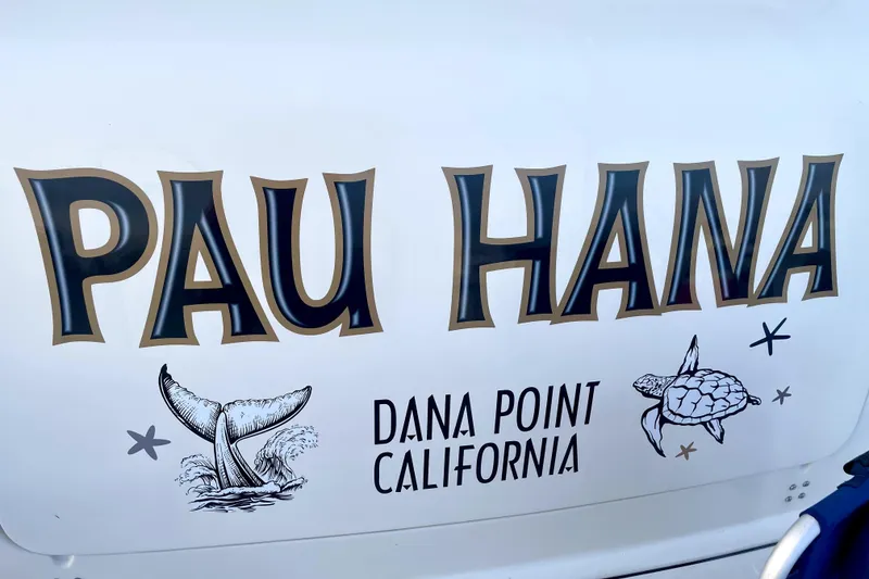 Slide: The Image of 1998 Tiara Yachts 3500 Express with "Pau Hana" text, Dana Point, California. - 12