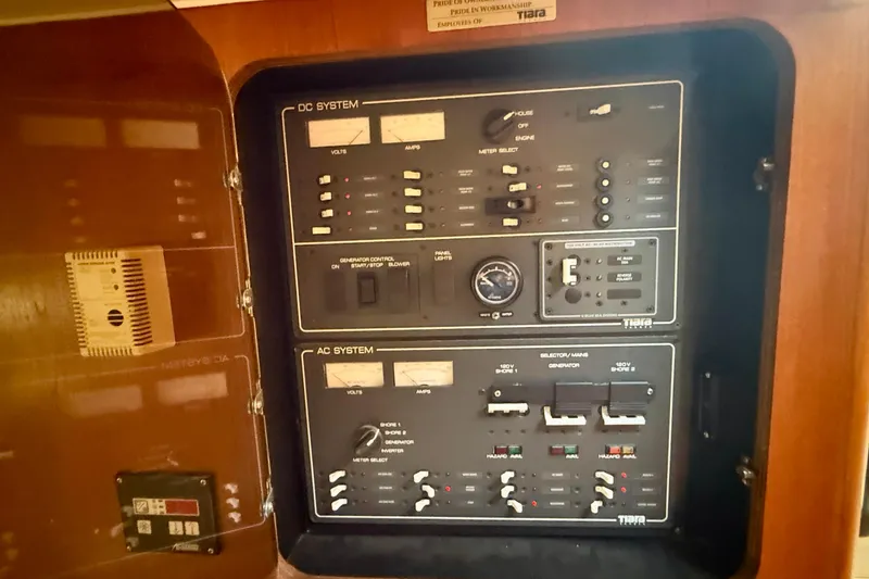 Slide: The Image of Electrical control panel of a 1998 Tiara Yachts 3500 Express boat. - 25