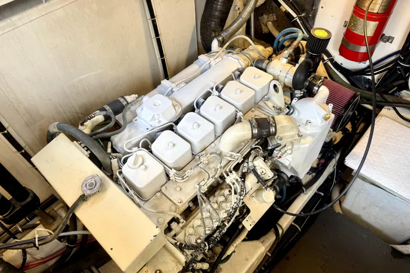Slide: The Image of Engine compartment of a 1998 Tiara Yachts 3500 Express, showcasing detailed mechanical components. - 39