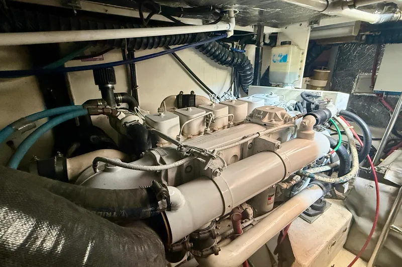 Slide: The Image of Engine room of a 1998 Tiara Yachts 3500 Express, showcasing detailed machinery. - 40