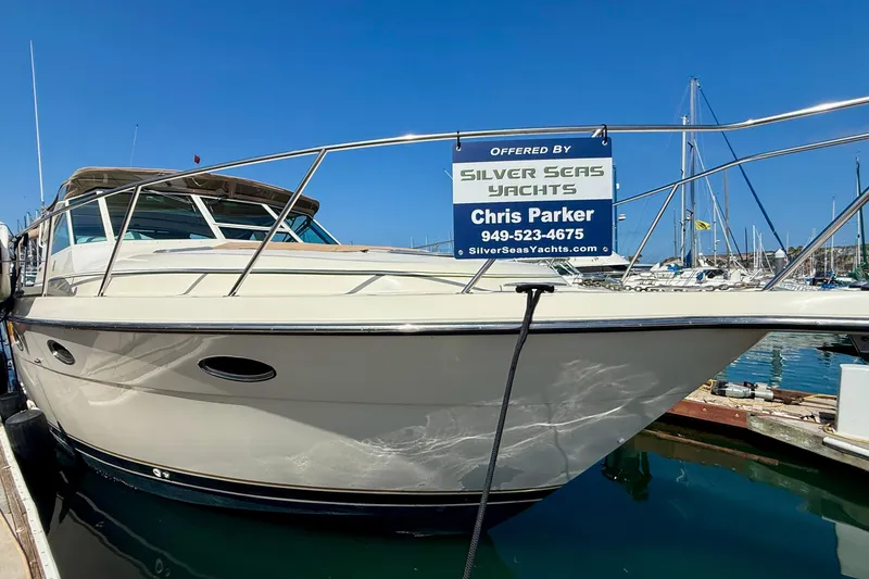 Slide: The Image of 1998 Tiara Yachts 3500 Express docked, offered by Silver Seas Yachts, sunny marina backdrop. - 41