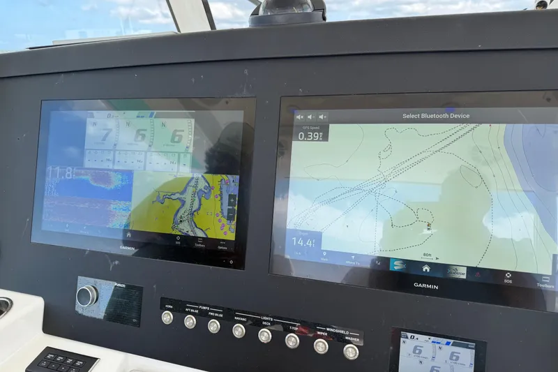 Slide: The Image of Dashboard of a 2023 Regulator 37 boat with Garmin navigation displays. - 2