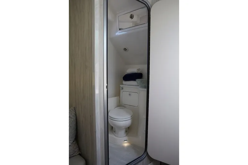 Slide: The Image of 2023 Regulator 37 boat interior bathroom with modern amenities and compact design. - 29