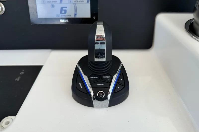Slide: The Image of Joystick control on 2023 Regulator 37 boat dashboard with digital display. - 4