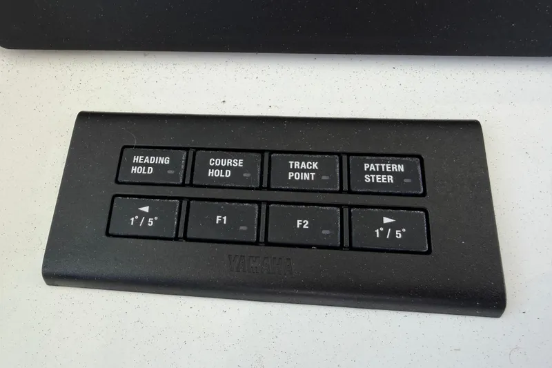 Slide: The Image of Control panel of a 2023 Regulator 37 boat with navigation buttons. - 5