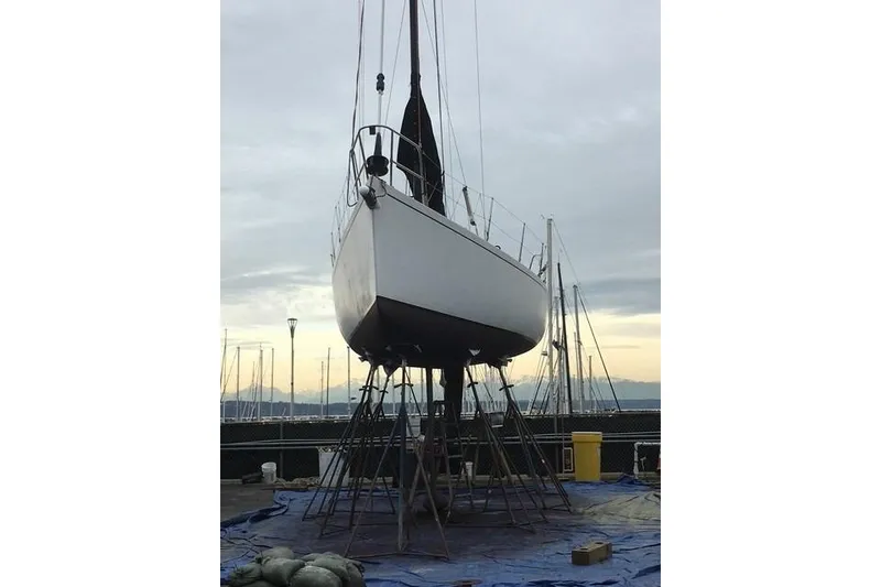 Slide: The Image of Sailboat Bravura B35 (1999) on stands at marina, overcast sky. - 15