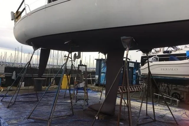 Slide: The Image of Sailboat Bravura B35 (1999) on stands in a marina for maintenance. - 16