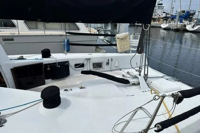 Slide: The Image of Sailboat Bravura B35, 1999 model, docked at marina with visible deck and rigging. - 19