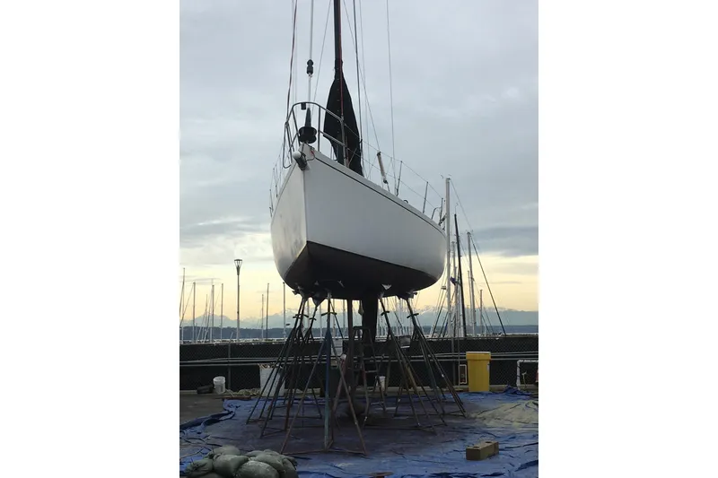 Slide: The Image of Sailboat Bravura B35 from 1999 on stands at a marina, overcast sky. - 9