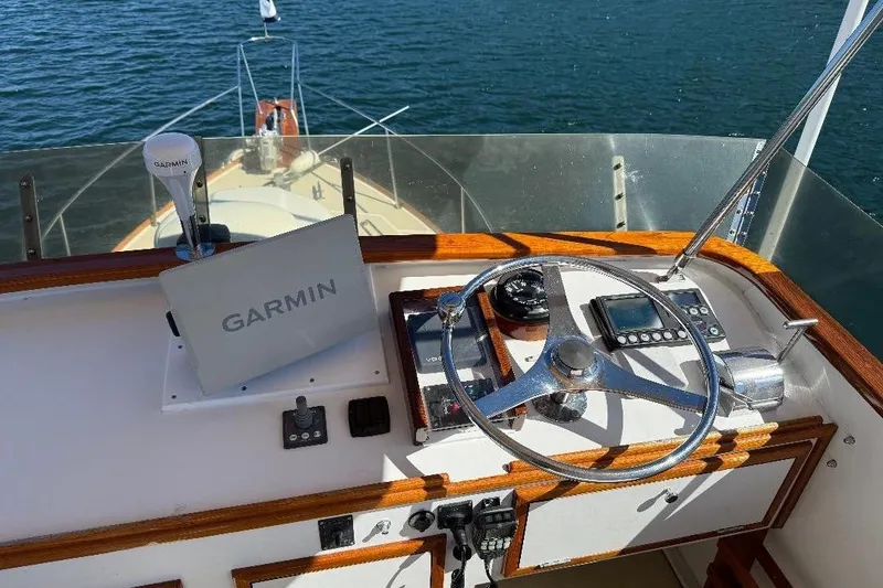 Slide: The Image of 1995 Wilbur Weekender boat helm with Garmin navigation system on open water. - 10