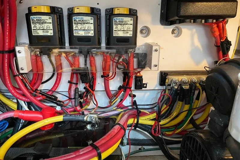 Slide: The Image of Electrical wiring setup in a 1995 Wilbur Weekender boat, featuring Blue Sea Systems components. - 34