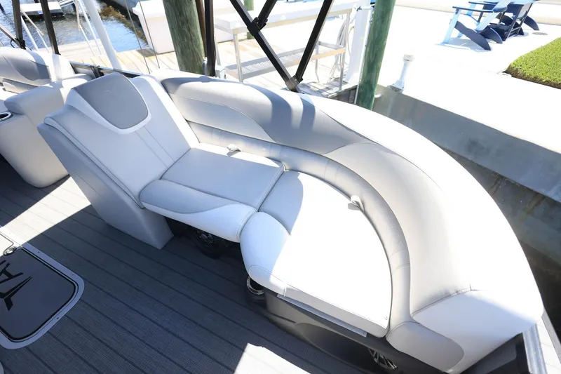 Slide: The Image of Luxurious seating on 2025 Tahoe Pontoon LTZ 23, featuring sleek white upholstery. - 8